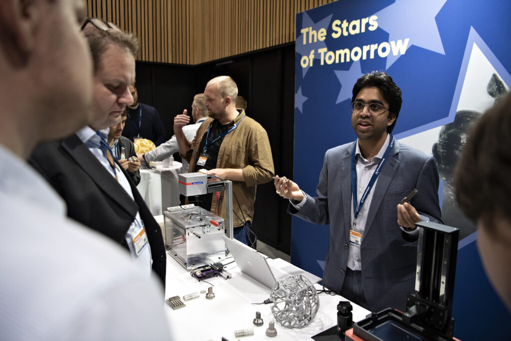 Staff from DTU Mechanics showcasing research to visitors. Photo: Lars Holm