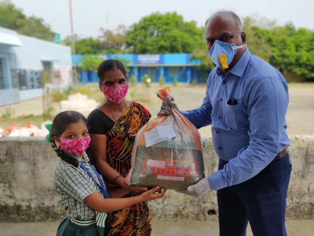 Hand In Hand India distributes supplies to underprivileged families at Karapakkam School, India