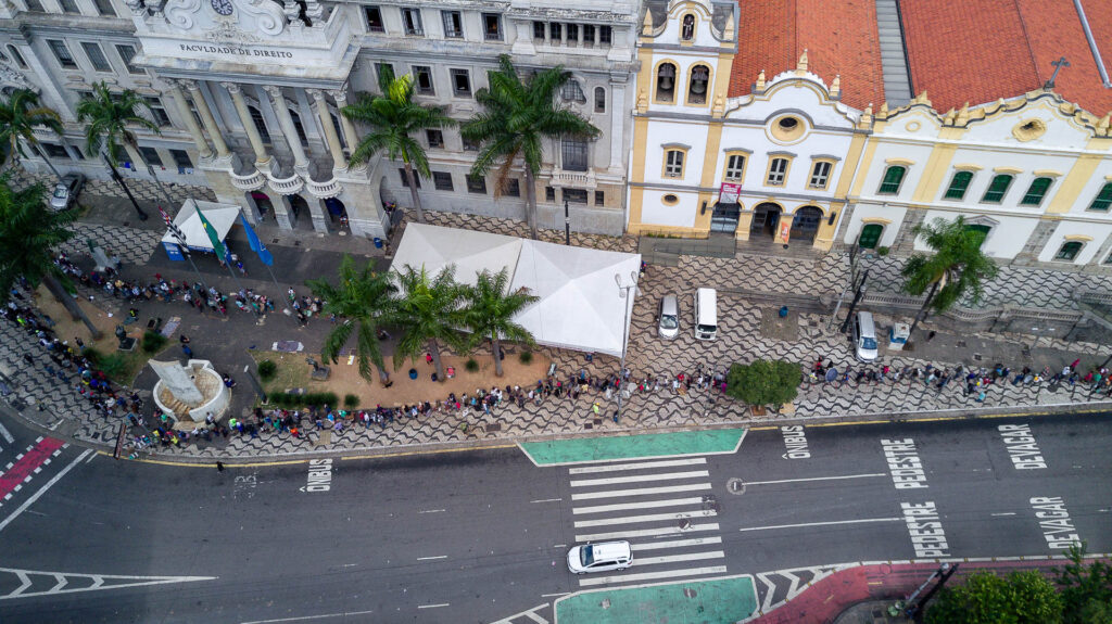 Queue on streets at food distribution in Sao Paolo, Brazil