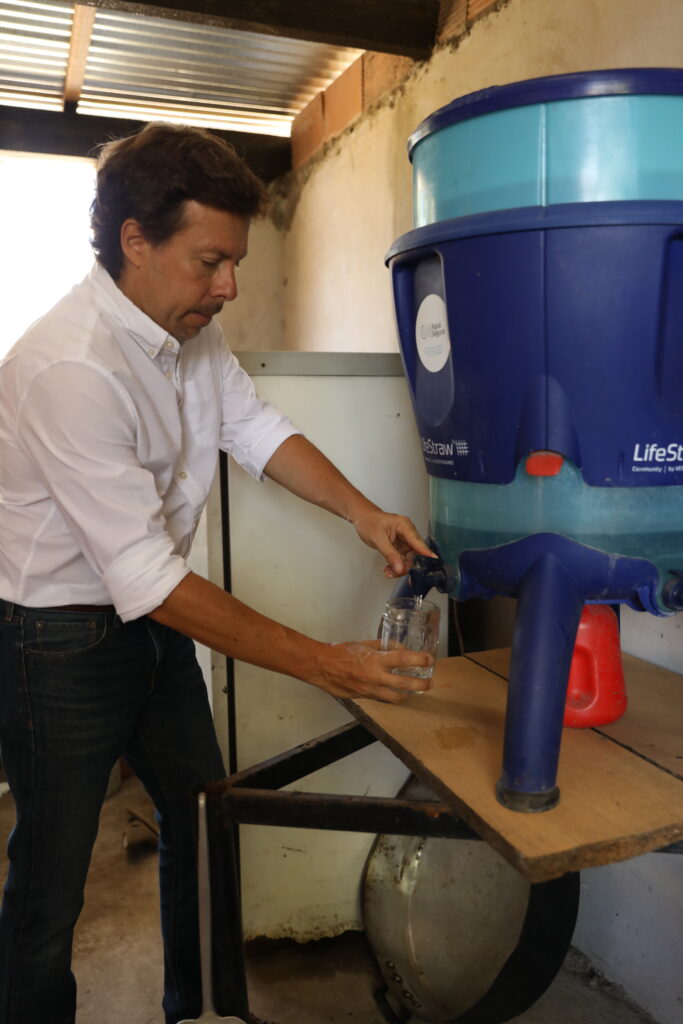 Santiago Arriola uses the LifeStraw  water filter that enables the community to purify the water.