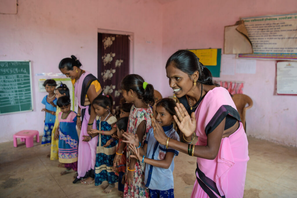 Lata Noushu Pardhi, 29, teaches poems while dancing with the students in Anganwadi Centre (Rural Childcare Centre) in Mohupada village.