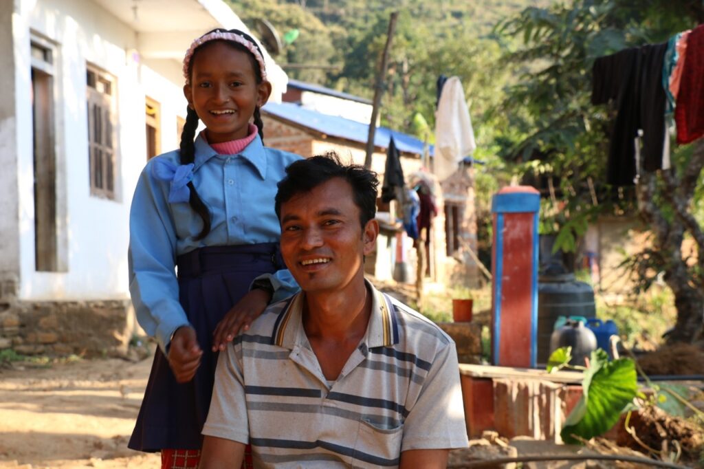 In the photo: Krishna Surkheti with his Daughter. 