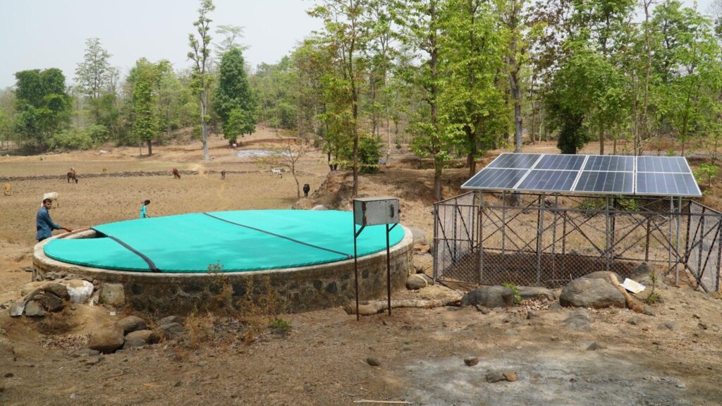 Covered open well with solar panels to the right