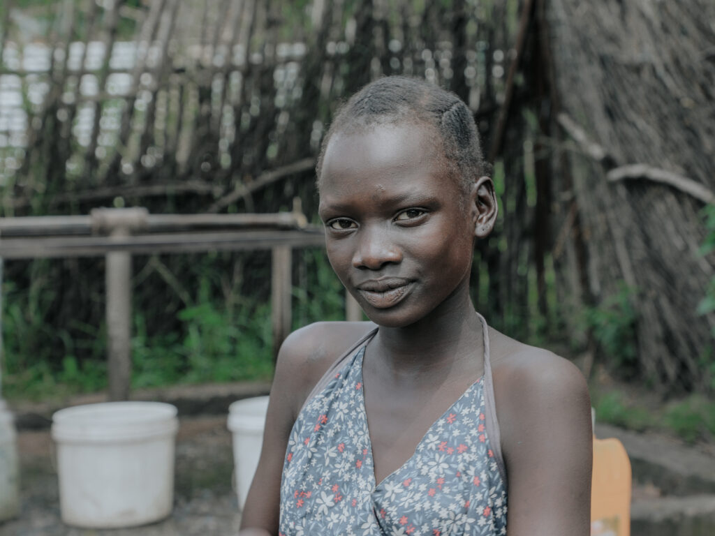 Young lady in front of washing station in Gambella refugee Camp, Ethiopa.