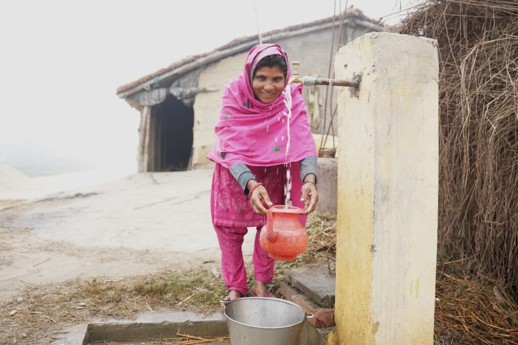 A woman from Rautahat, with a functional water supply tap ( as a part of the AMM project) in her yard. Most of the population in Rautahat have no choice but to drink tube well water often contaminated with iron and arsenic.