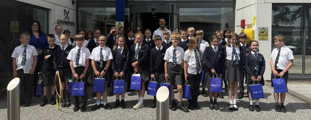 Pupils in front of Grundfos office in Leighton Buzzard